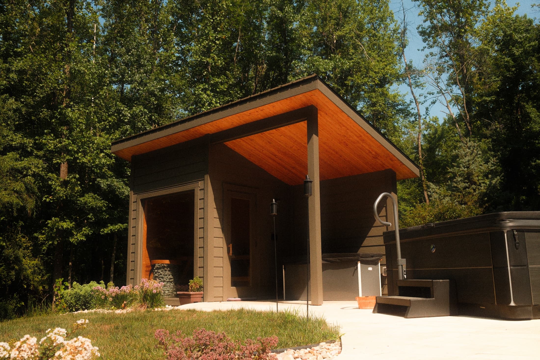 A custom-built sauna in a backyard.